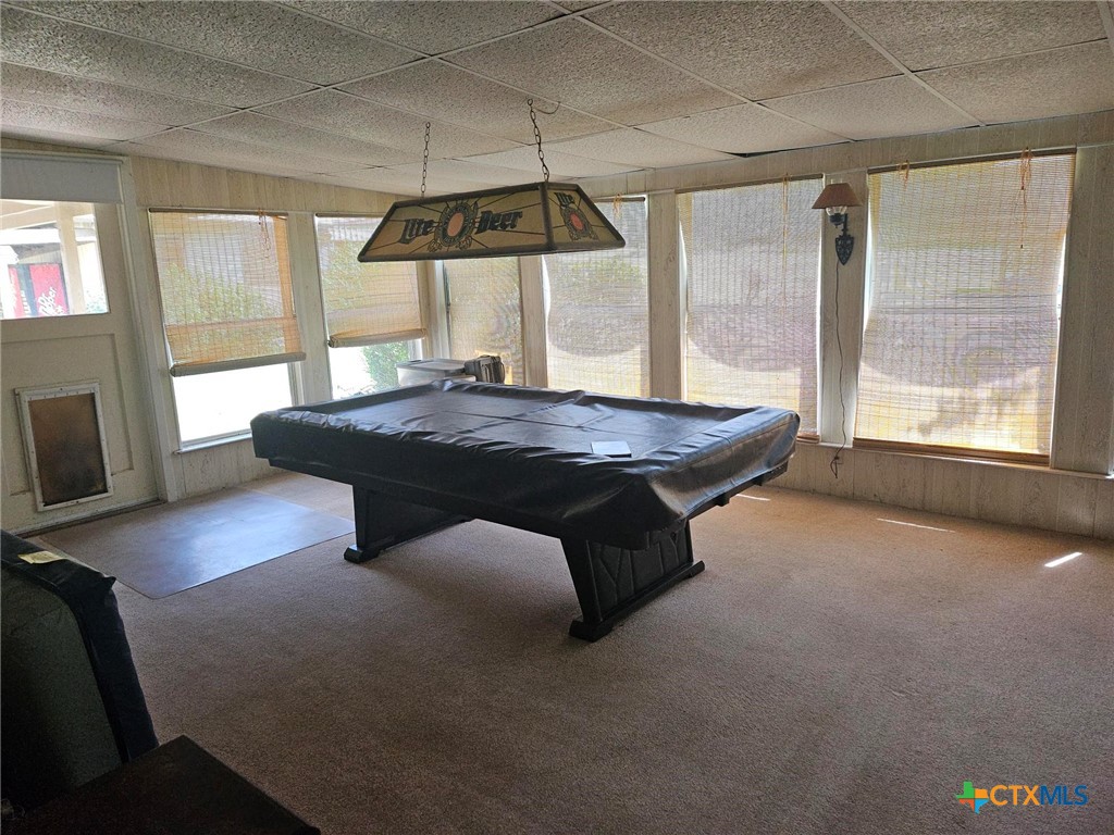 601 North Rhomberg Street Burnet, TX 78611 - Photo 24 of 42 a living room with furniture and a flat screen tv