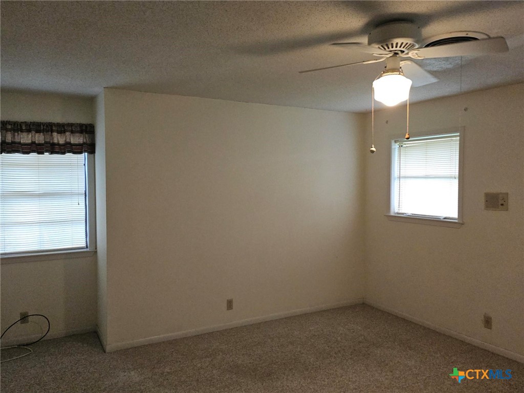 601 North Rhomberg Street Burnet, TX 78611 - Photo 36 of 42 an empty room with windows and fan