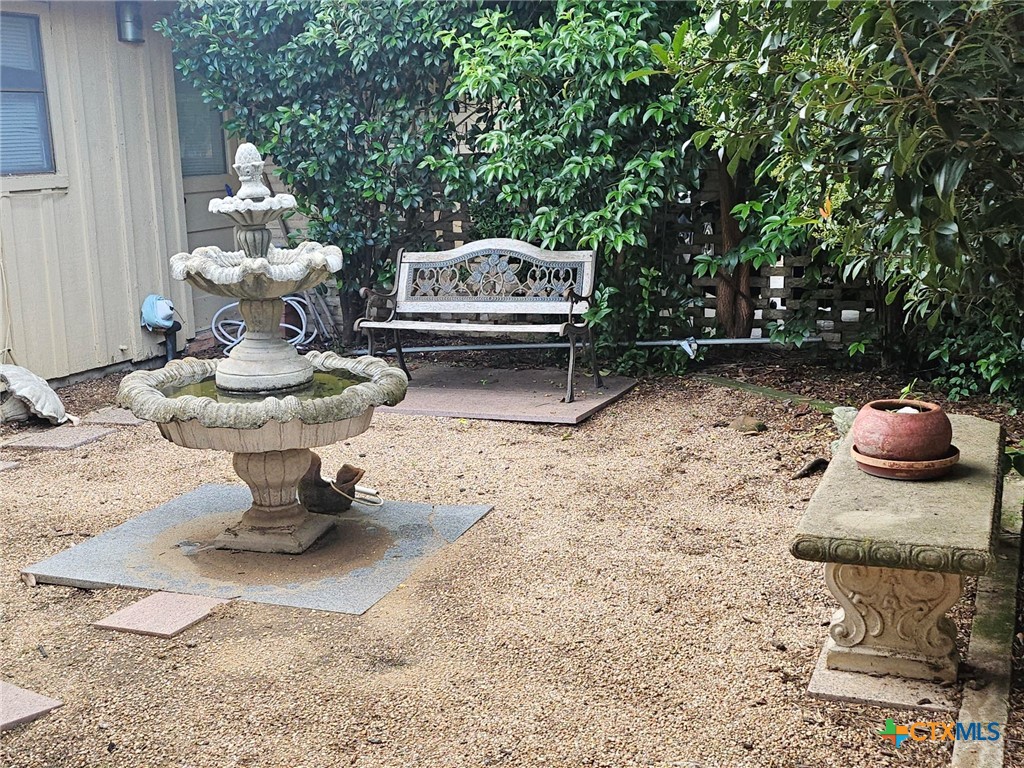 601 North Rhomberg Street Burnet, TX 78611 - Photo 7 of 42 a view of a bench in backyard