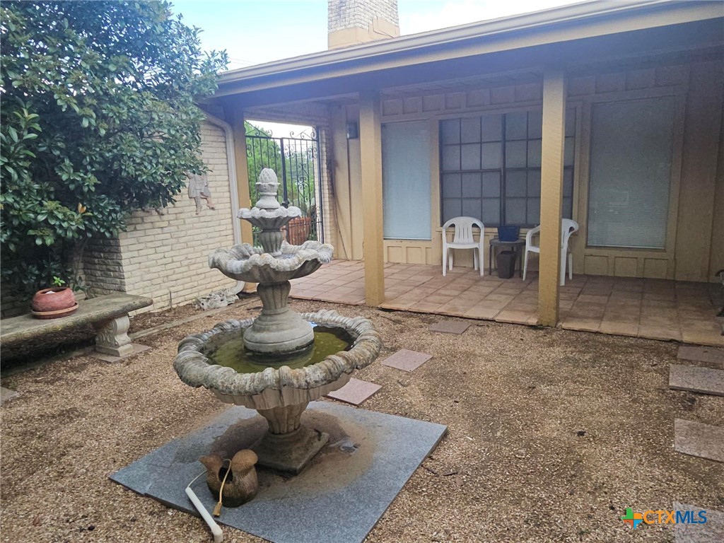 601 North Rhomberg Street Burnet, TX 78611 - Photo 8 of 42 a view of a patio with table and chairs