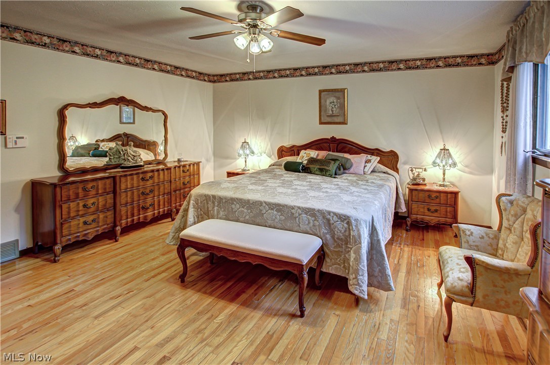 6013 Rousseau Drive Parma, OH 44129 - Photo 20 of 50 Master bedroom with light hardwood / wood-style floors and ceiling fan
