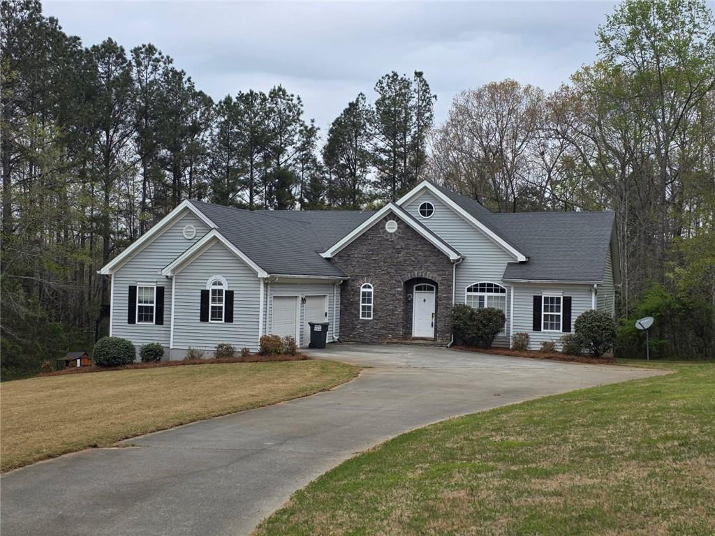 7387 Milam Road Winston, GA 30187 - Photo 41 of 41 a front view of a house with a yard and trees