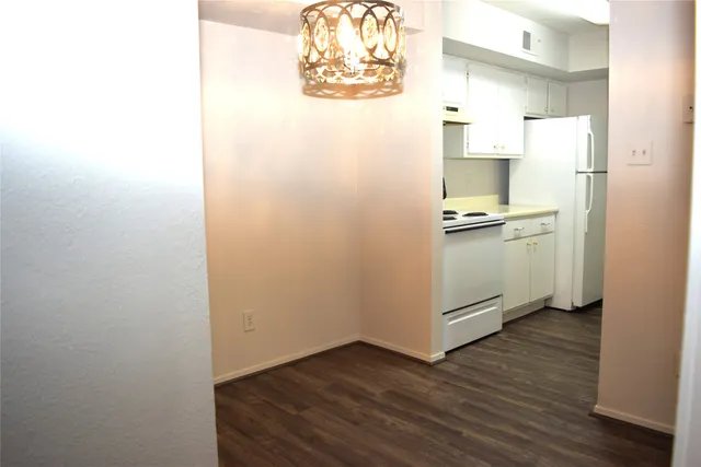 a view of kitchen and wooden floor