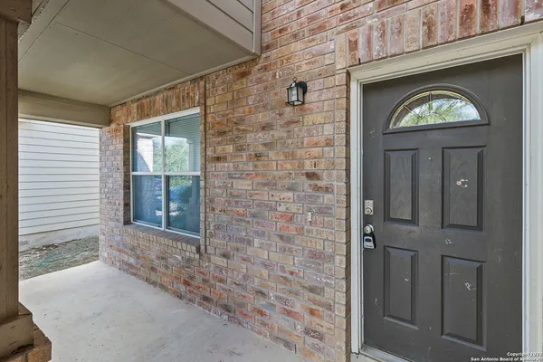 a view of a brick house with a door