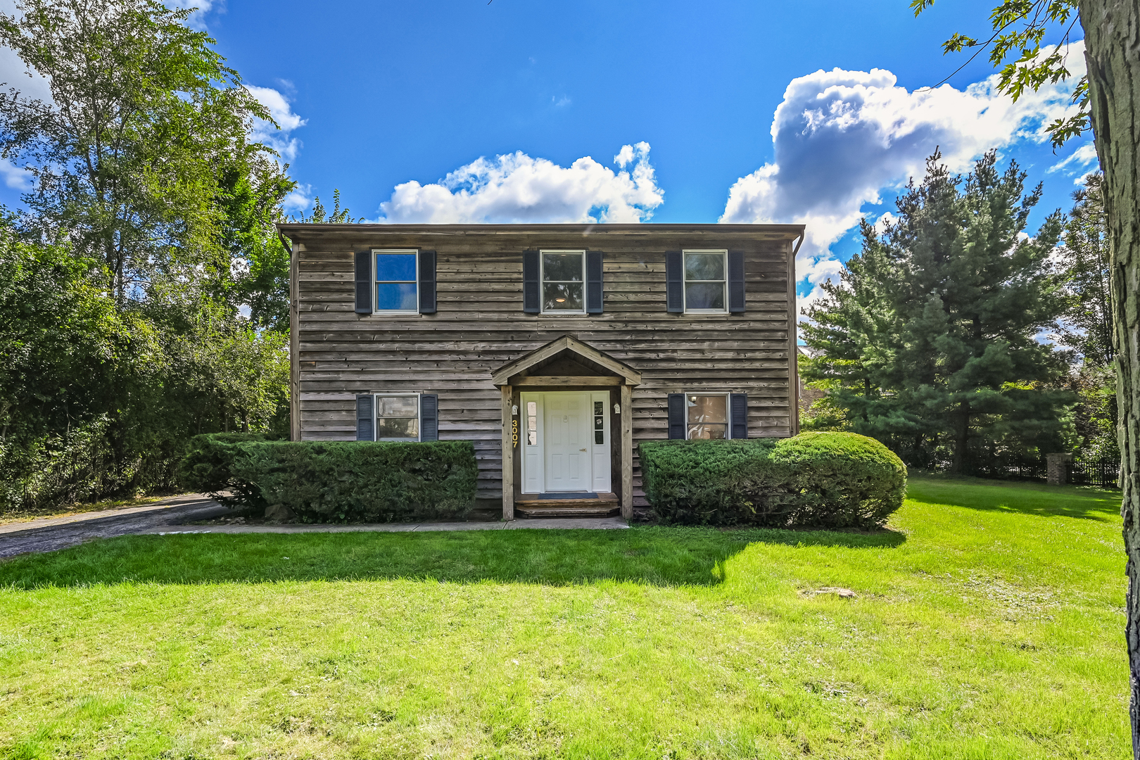 3007 Lincoln Road Oak Brook, IL 60523 - Photo 1 of 25 a front view of a house with a yard