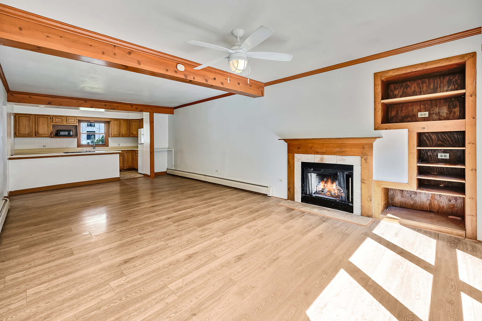 3007 Lincoln Road Oak Brook, IL 60523 - Photo 11 of 25 a view of an empty room with a fireplace and a window