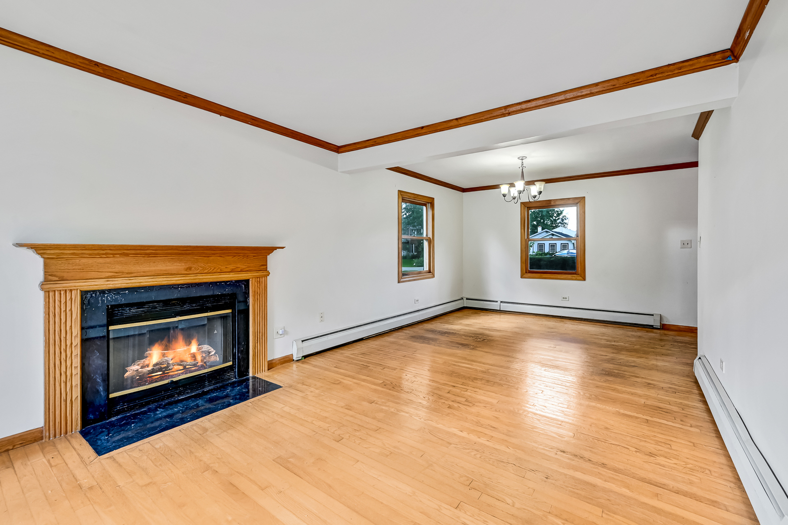 3007 Lincoln Road Oak Brook, IL 60523 - Photo 7 of 25 a view of an empty room with window and fire place