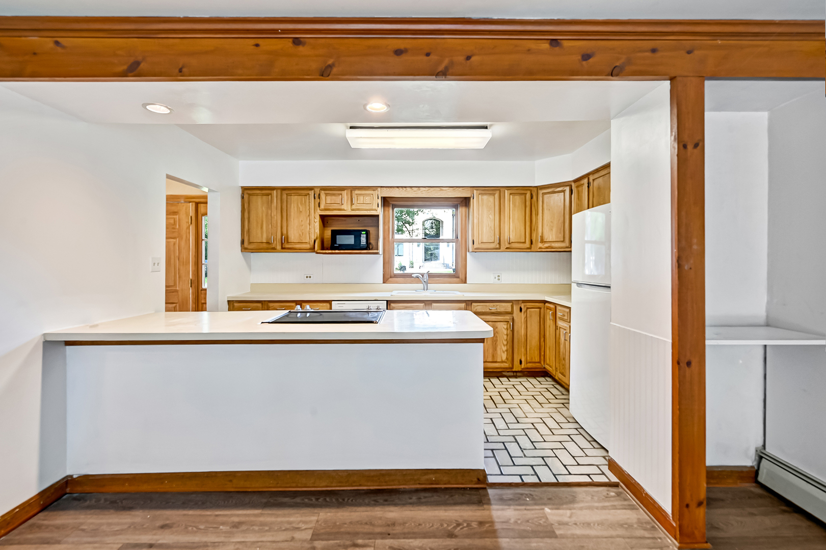 3007 Lincoln Road Oak Brook, IL 60523 - Photo 9 of 25 a kitchen with stainless steel appliances a stove a sink and a refrigerator