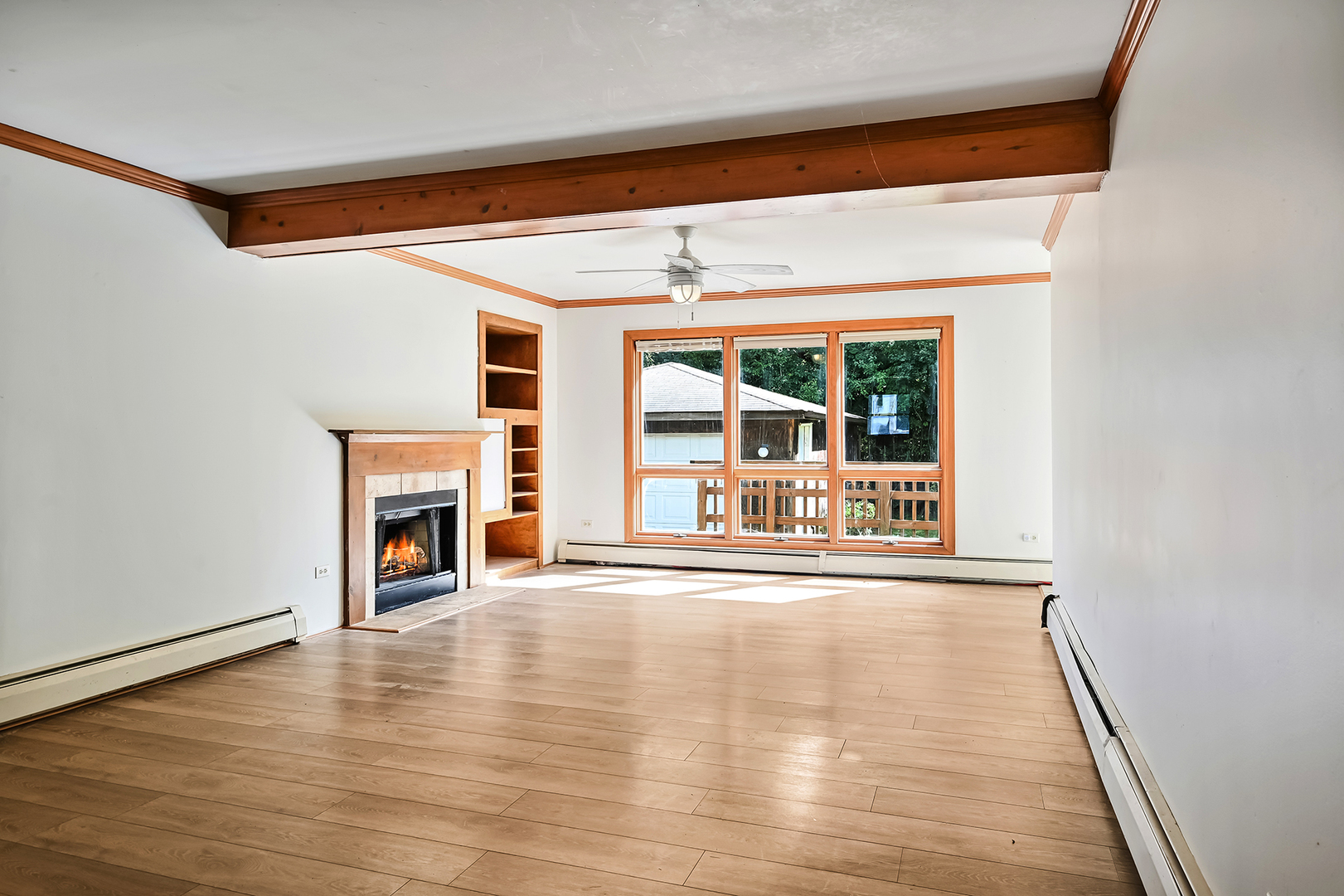 3007 Lincoln Road Oak Brook, IL 60523 - Photo 10 of 25 a view of a livingroom with wooden floor and a fireplace