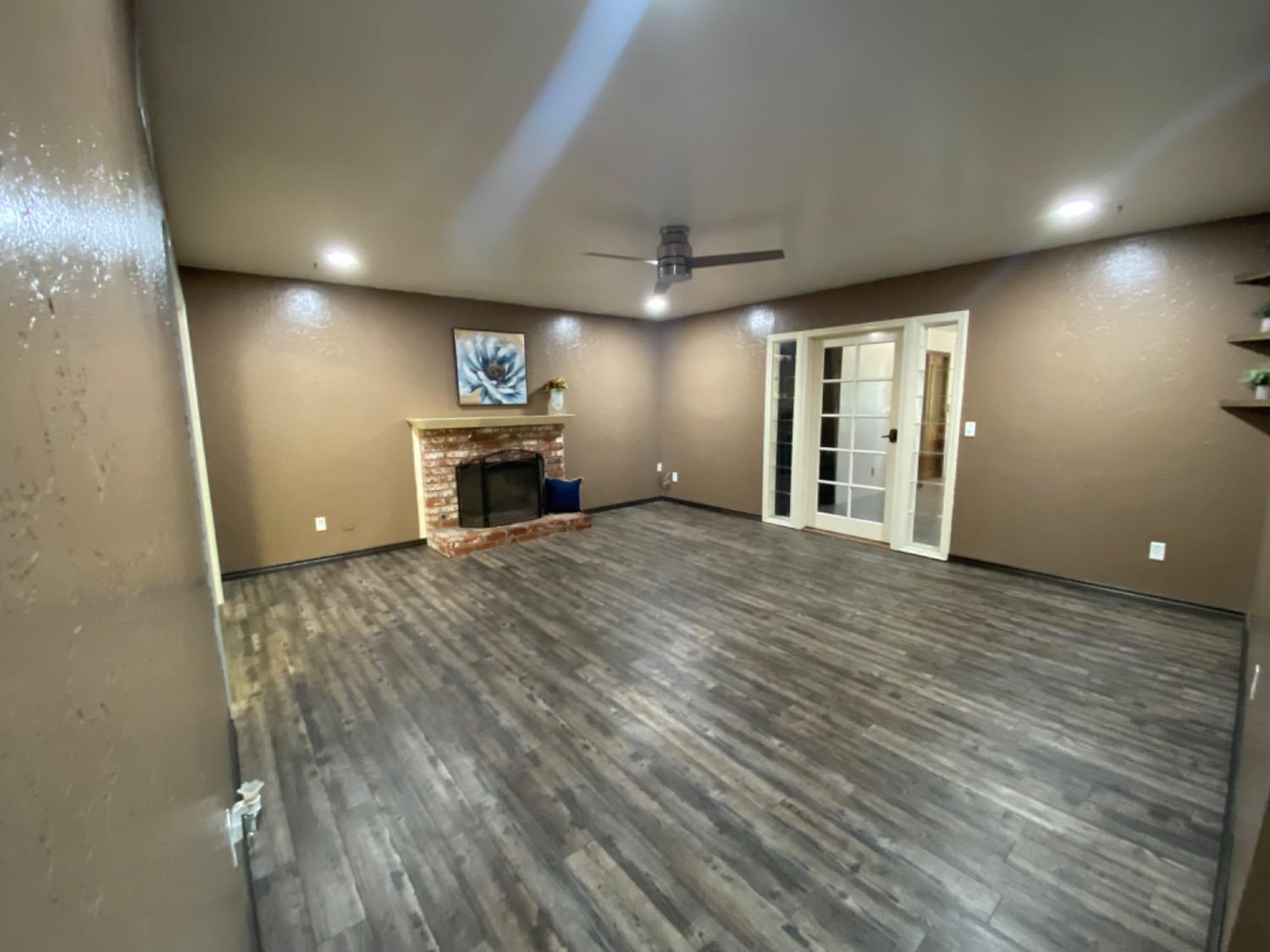 1712 Bundy Avenue Clovis, CA 93611 - Photo 8 of 9 a view of a livingroom with a fireplace