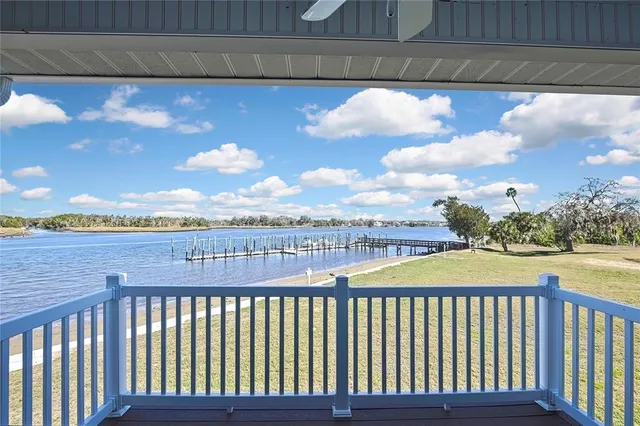 a view of a balcony with wooden floor