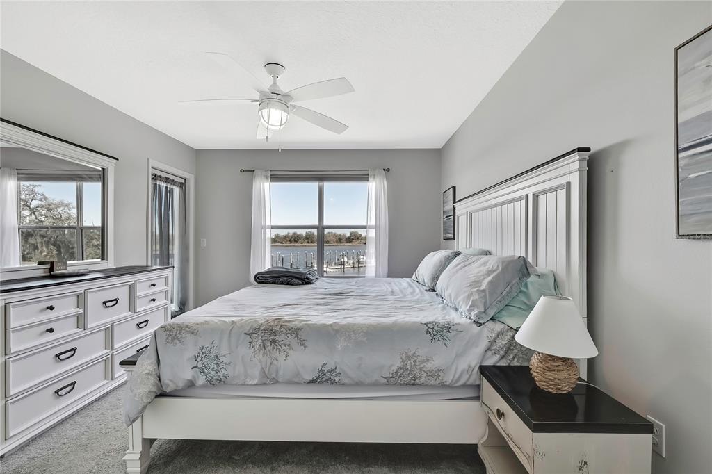 2855 North Rivers Edge Boulevard, Unit 213 Crystal River, FL 34429 - Photo 24 of 62 a bedroom with a bed a window and dresser