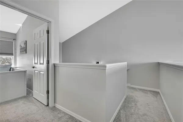 a bedroom with a double vanity sink and a mirror