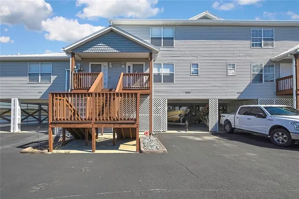 a view of a car park in front of house