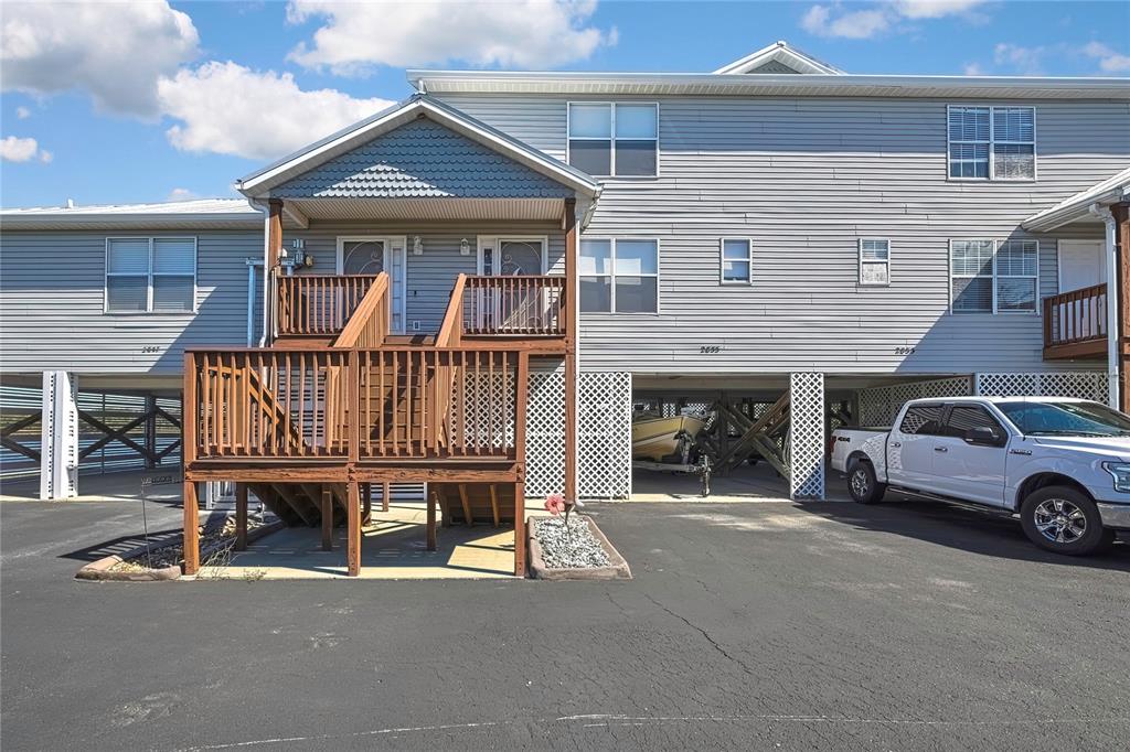 2855 North Rivers Edge Boulevard, Unit 213 Crystal River, FL 34429 - Photo 3 of 62 a view of a car park in front of house