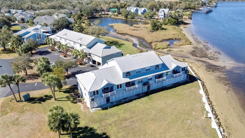 2855 North Rivers Edge Boulevard, Unit 213 Crystal River, FL 34429 - Photo 44 of 62 an aerial view of a house with a yard basket ball court and outdoor seating