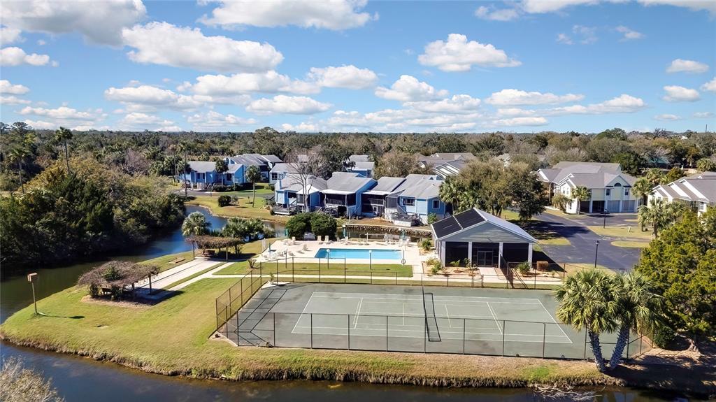 2855 North Rivers Edge Boulevard, Unit 213 Crystal River, FL 34429 - Photo 52 of 62 a view of a swimming pool with outdoor seating