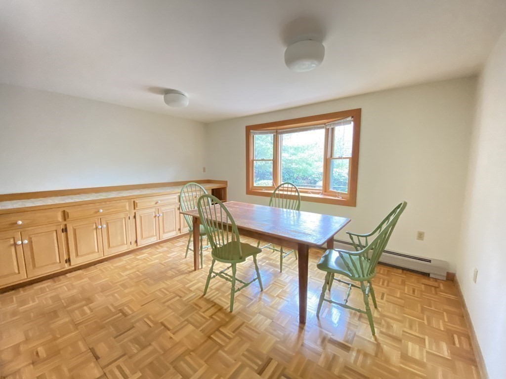 117 Rock O'Dundee Road Dartmouth, MA 02748 - Photo 14 of 24 a view of a dining room with furniture and a window