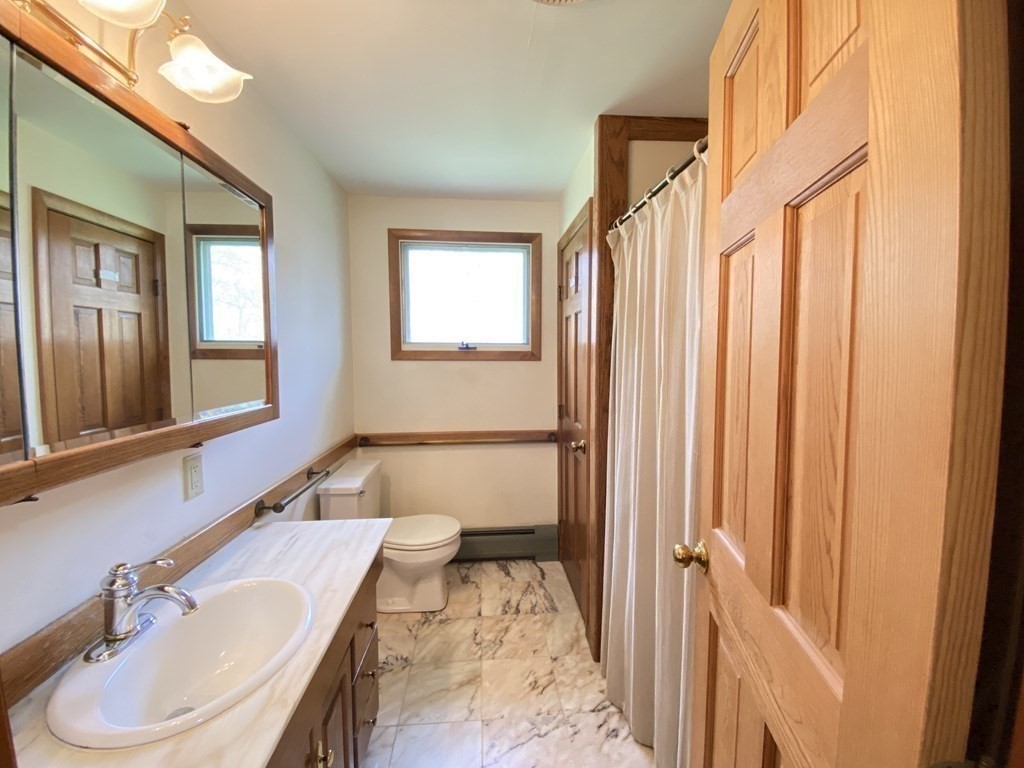 117 Rock O'Dundee Road Dartmouth, MA 02748 - Photo 18 of 24 a bathroom with a sink and a mirror