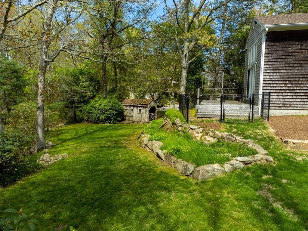 117 Rock O'Dundee Road Dartmouth, MA 02748 - Photo 24 of 24 a backyard of a house with table and chairs
