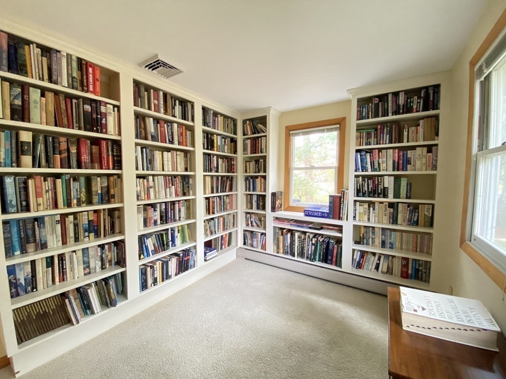 117 Rock O'Dundee Road Dartmouth, MA 02748 - Photo 5 of 24 a view of a living room with furniture and a book shelf