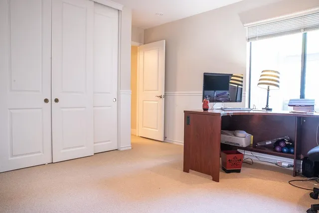 a workspace with a couch and a window