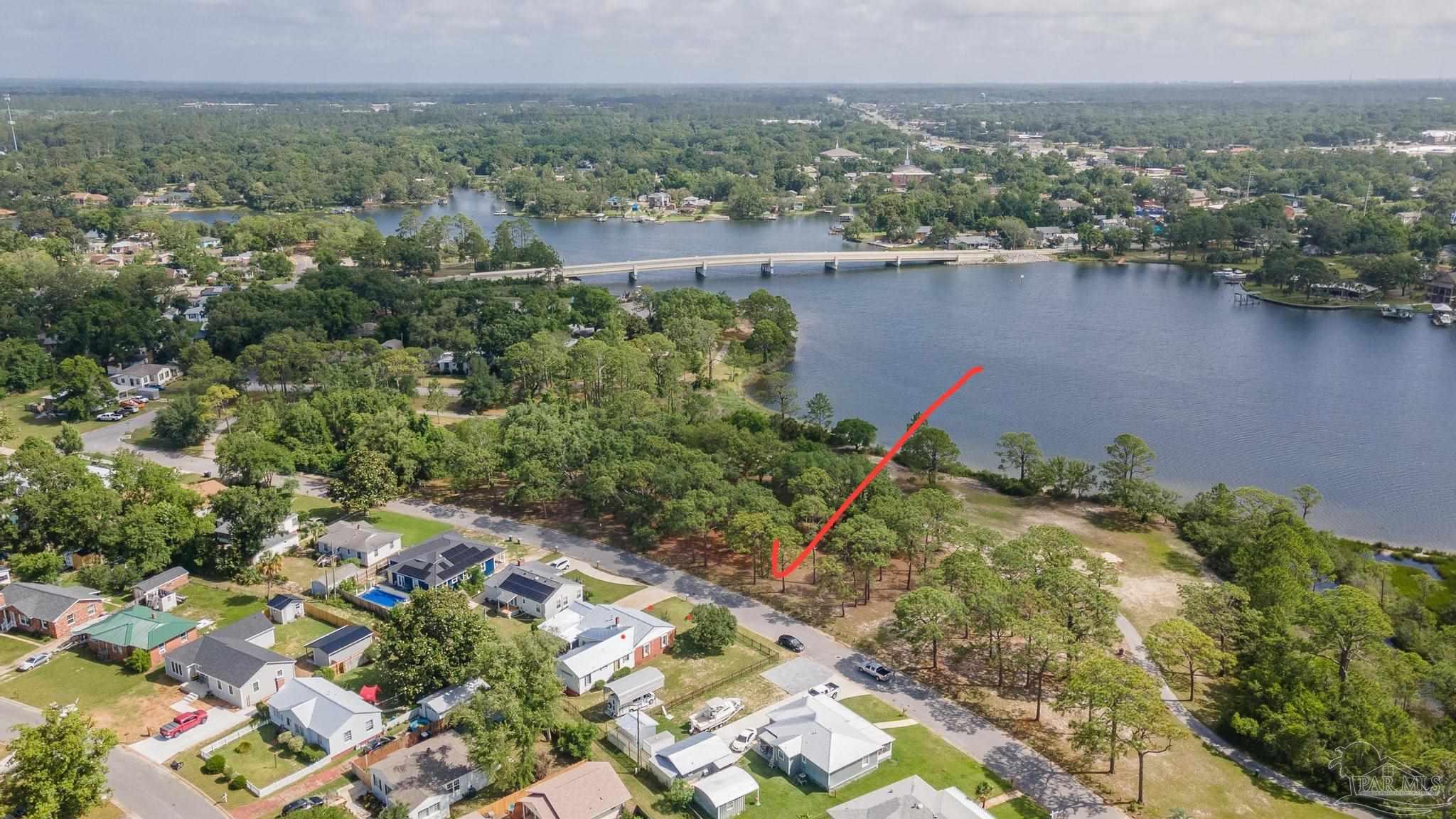 an aerial view of a house with a lake view