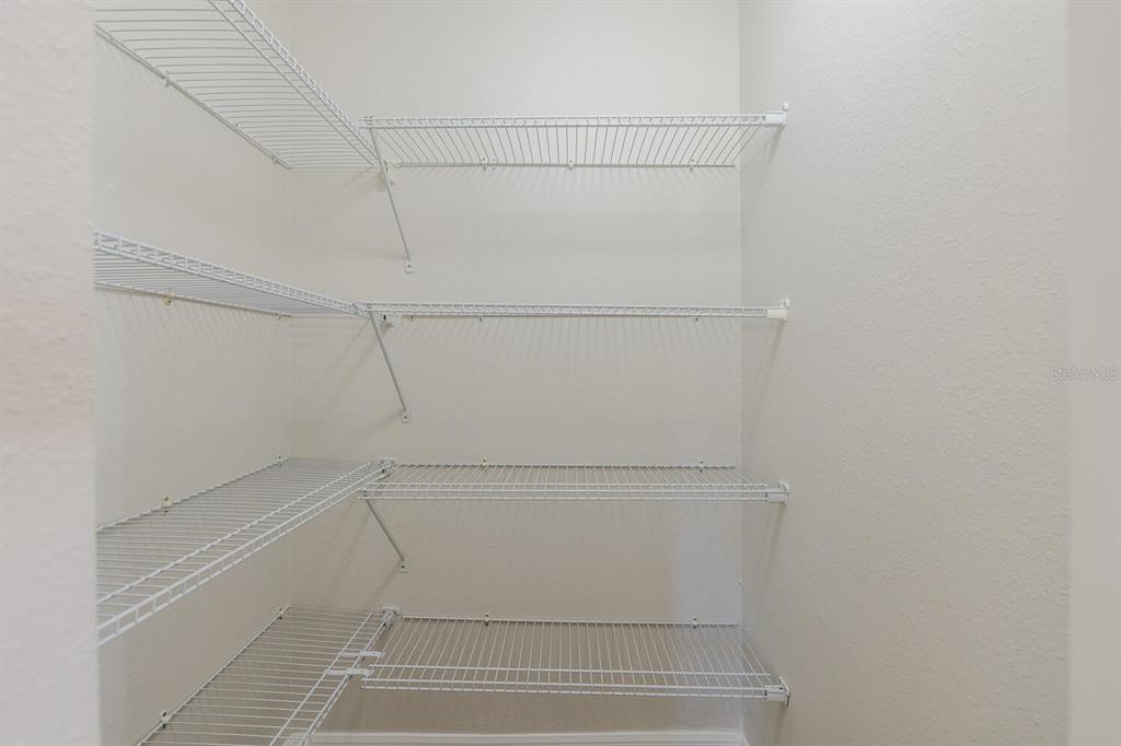 11718 Wheatfield Loop Hudson, FL 34667 - Photo 20 of 88 a view of an empty walk in closet