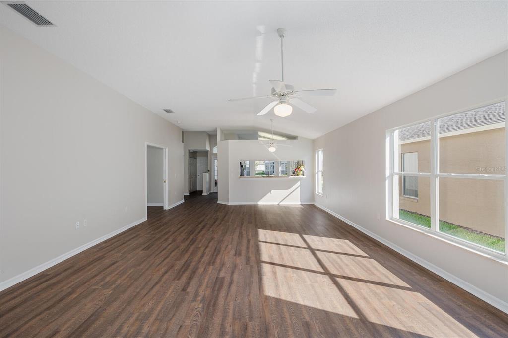 11718 Wheatfield Loop Hudson, FL 34667 - Photo 25 of 88 a view of a living room with a large window