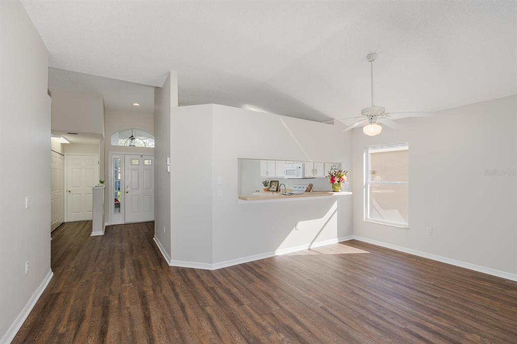 11718 Wheatfield Loop Hudson, FL 34667 - Photo 26 of 88 a view of a kitchen with wooden floor and a kitchen