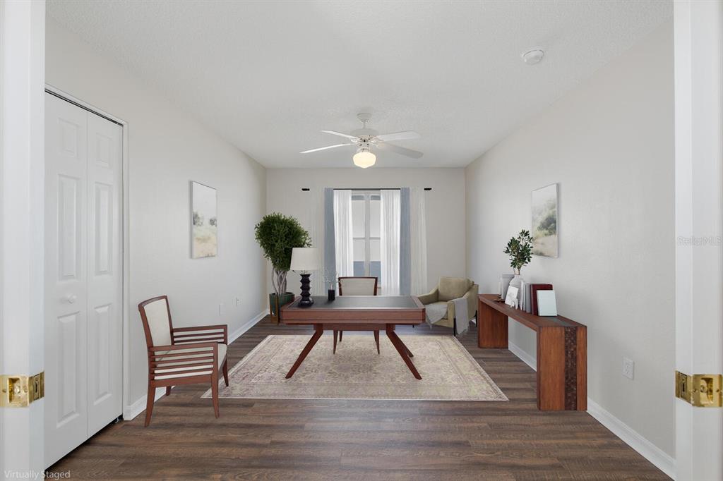 11718 Wheatfield Loop Hudson, FL 34667 - Photo 36 of 88 a room with furniture and a potted plant