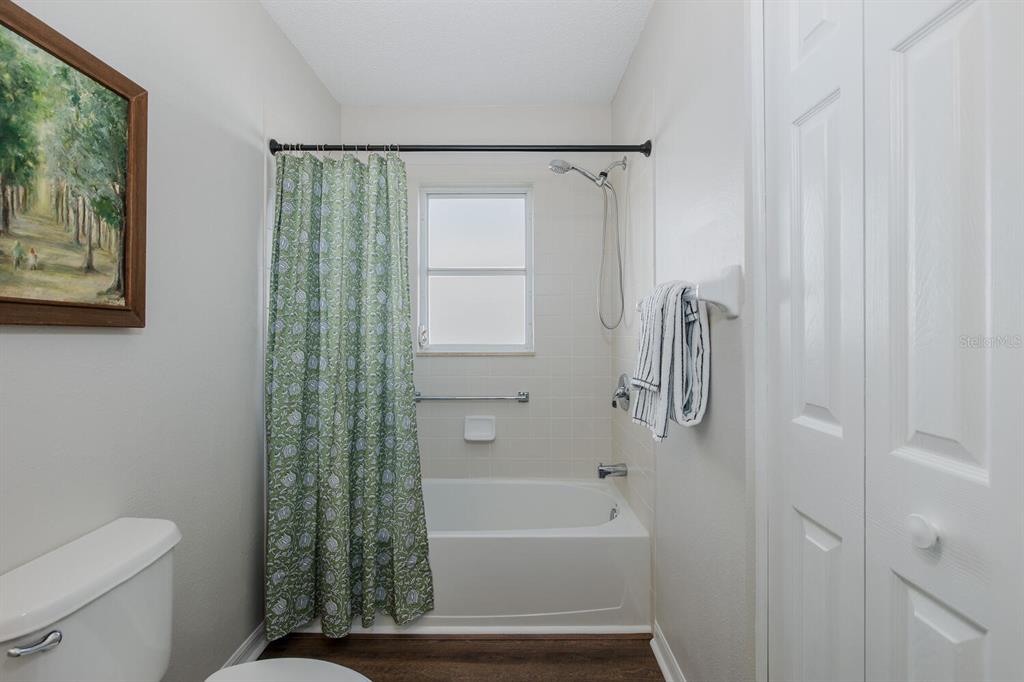 11718 Wheatfield Loop Hudson, FL 34667 - Photo 43 of 88 a bathroom with a toilet and a bathtub