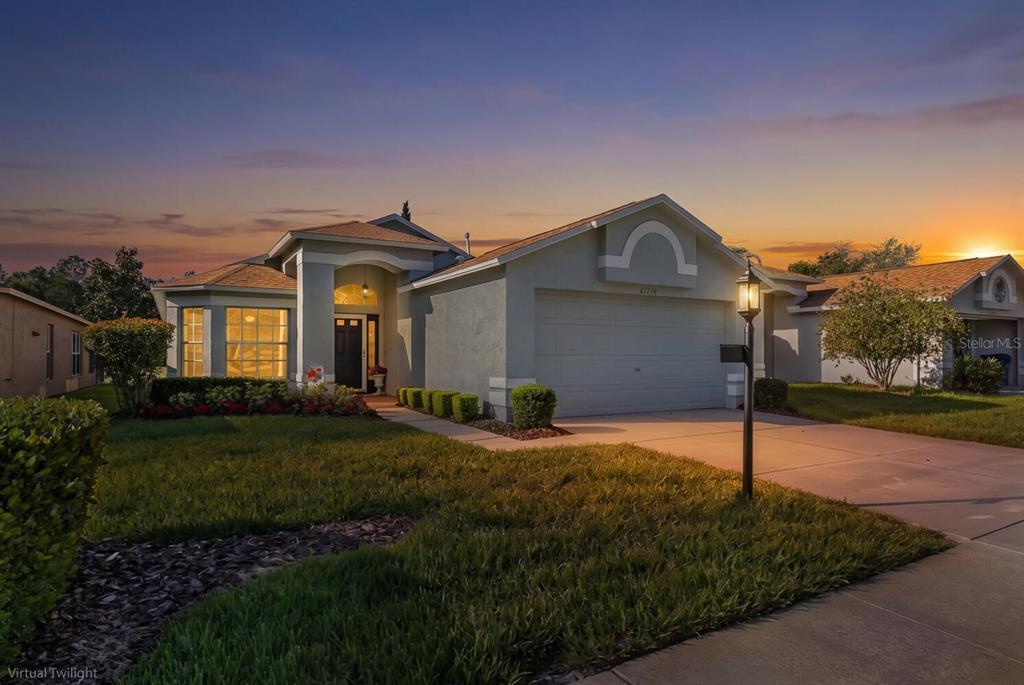 11718 Wheatfield Loop Hudson, FL 34667 - Photo 8 of 88 a front view of a house with a yard