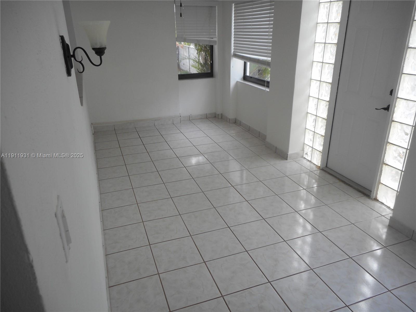 420 88th Street Surfside, FL 33154 - Photo 14 of 19 a view of an empty room with windows