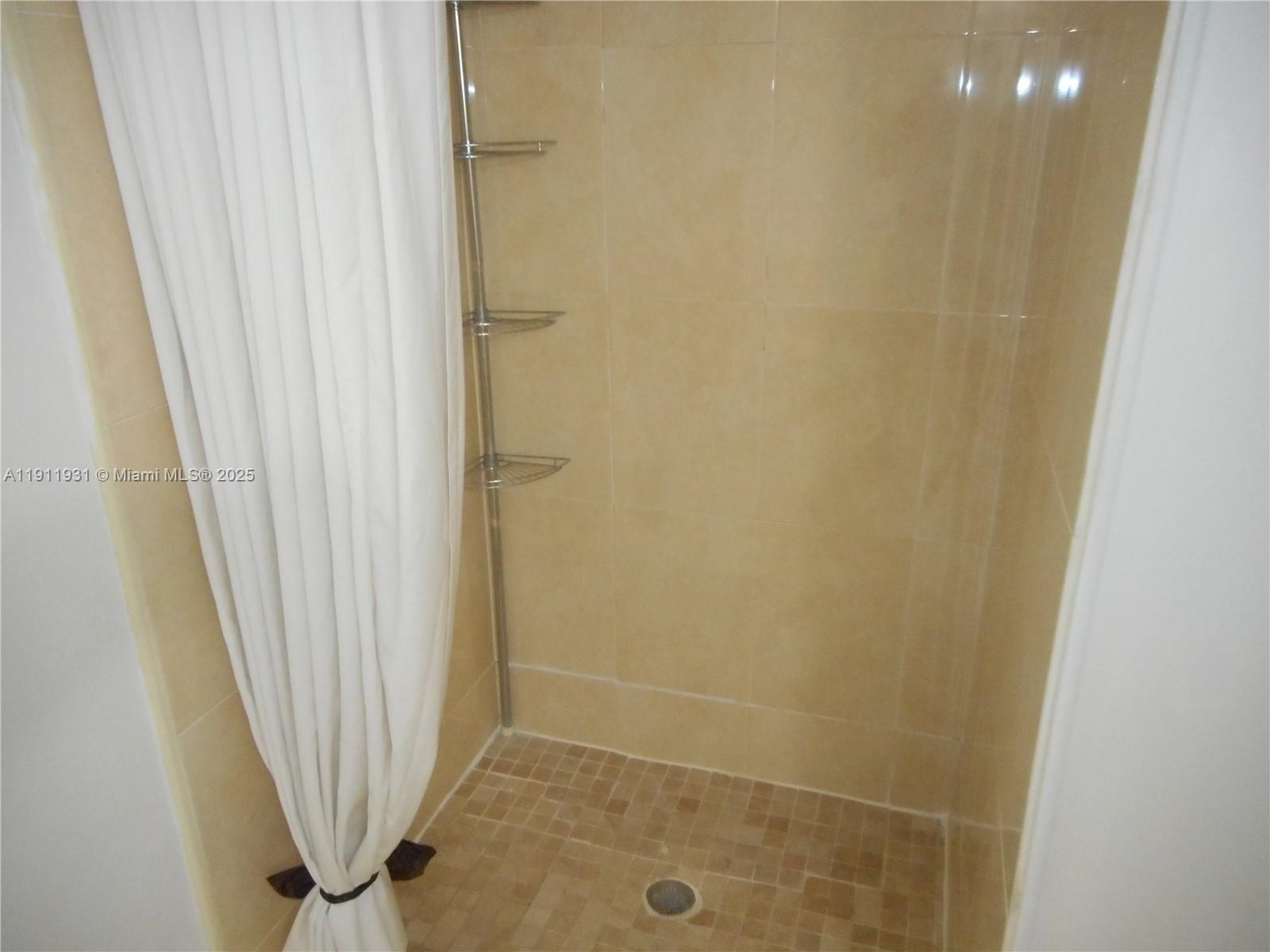 420 88th Street Surfside, FL 33154 - Photo 7 of 19 a bathroom with a shower
