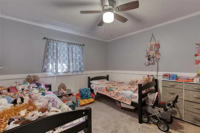 a bed room with a bed and a window