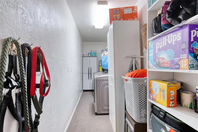 a view of a closet with storage