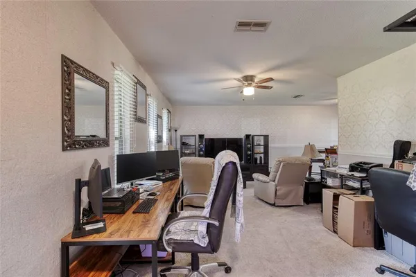 a view of a workspace with furniture