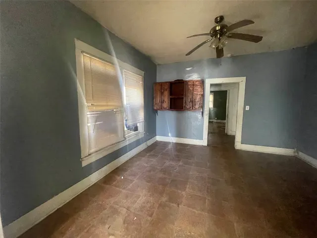 a view of livingroom with hardwood floor and a ceiling fan