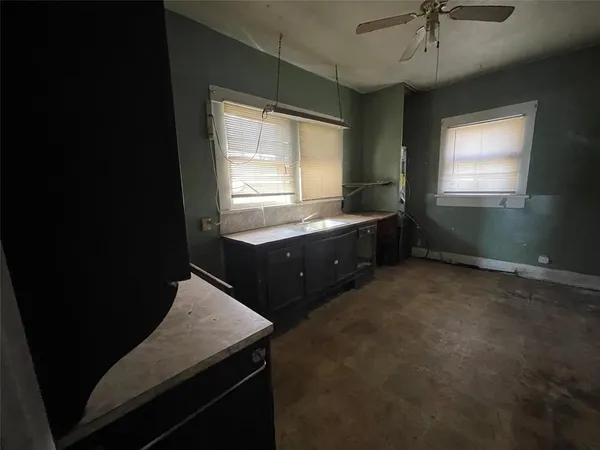 a room with painting and a table