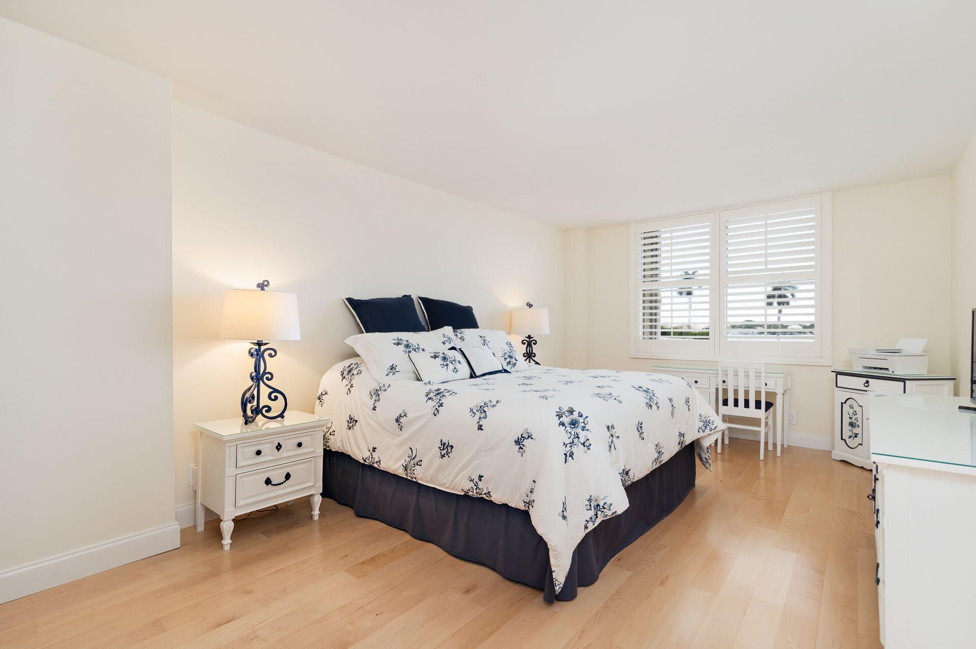 1701 South Flagler Drive, Unit 207 West Palm Beach, FL 33401 - Photo 12 of 26 a bedroom with a bed and a large window