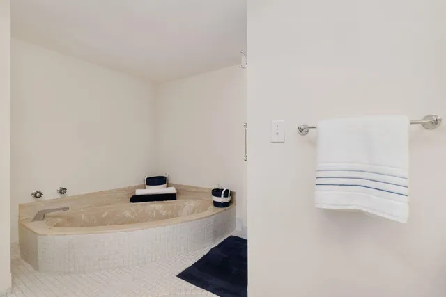 a bathroom with a sink vanity granite and a mirror