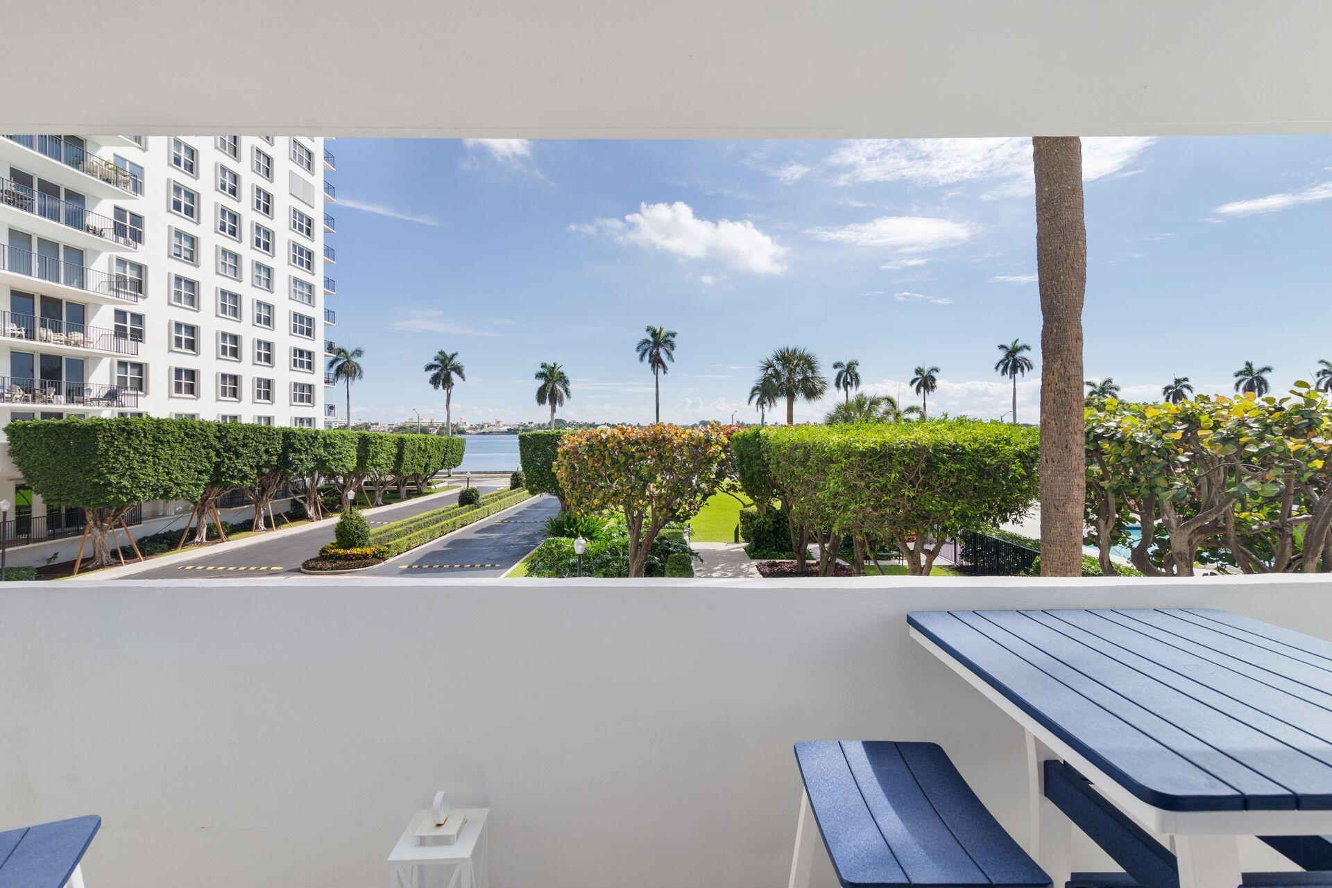 1701 South Flagler Drive, Unit 207 West Palm Beach, FL 33401 - Photo 17 of 26 a view of balcony with wooden floor and outdoor seating