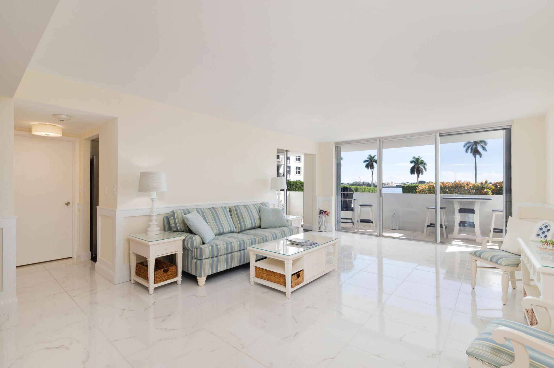 1701 South Flagler Drive, Unit 207 West Palm Beach, FL 33401 - Photo 2 of 26 a living room with furniture and a wooden floor