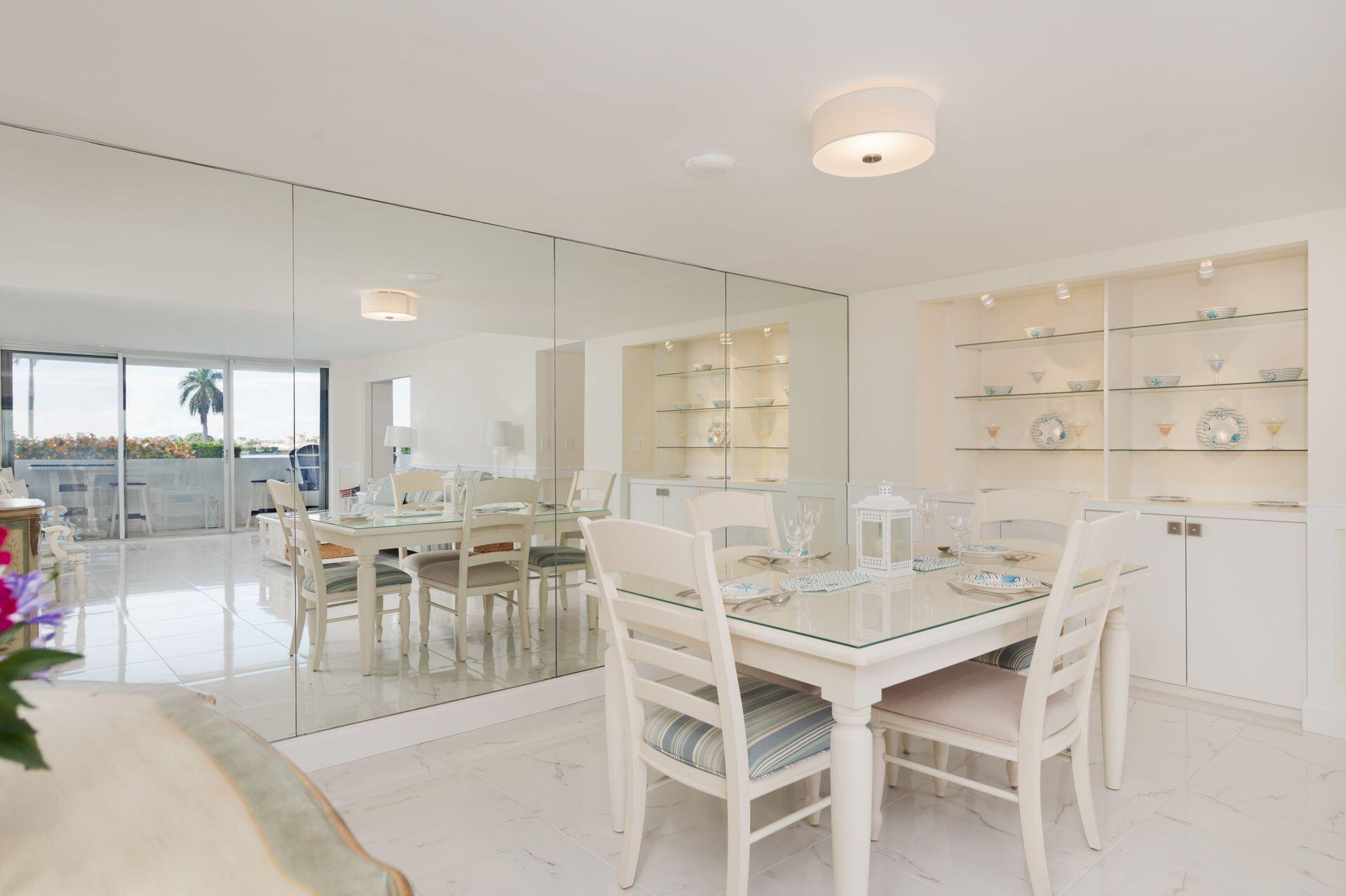 1701 South Flagler Drive, Unit 207 West Palm Beach, FL 33401 - Photo 6 of 26 a dining room with furniture and a large window