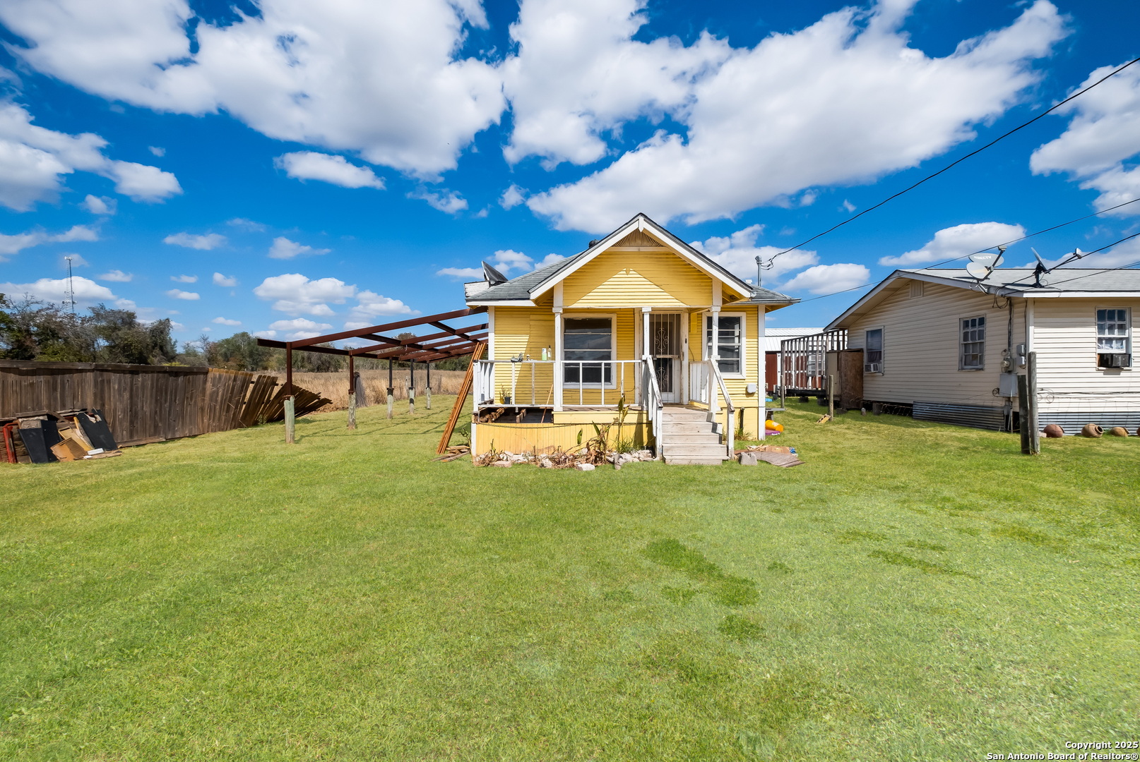 1231 Mogford Road San Antonio, TX 78264 - Photo 15 of 32 a view of a house with a backyard porch and sitting area