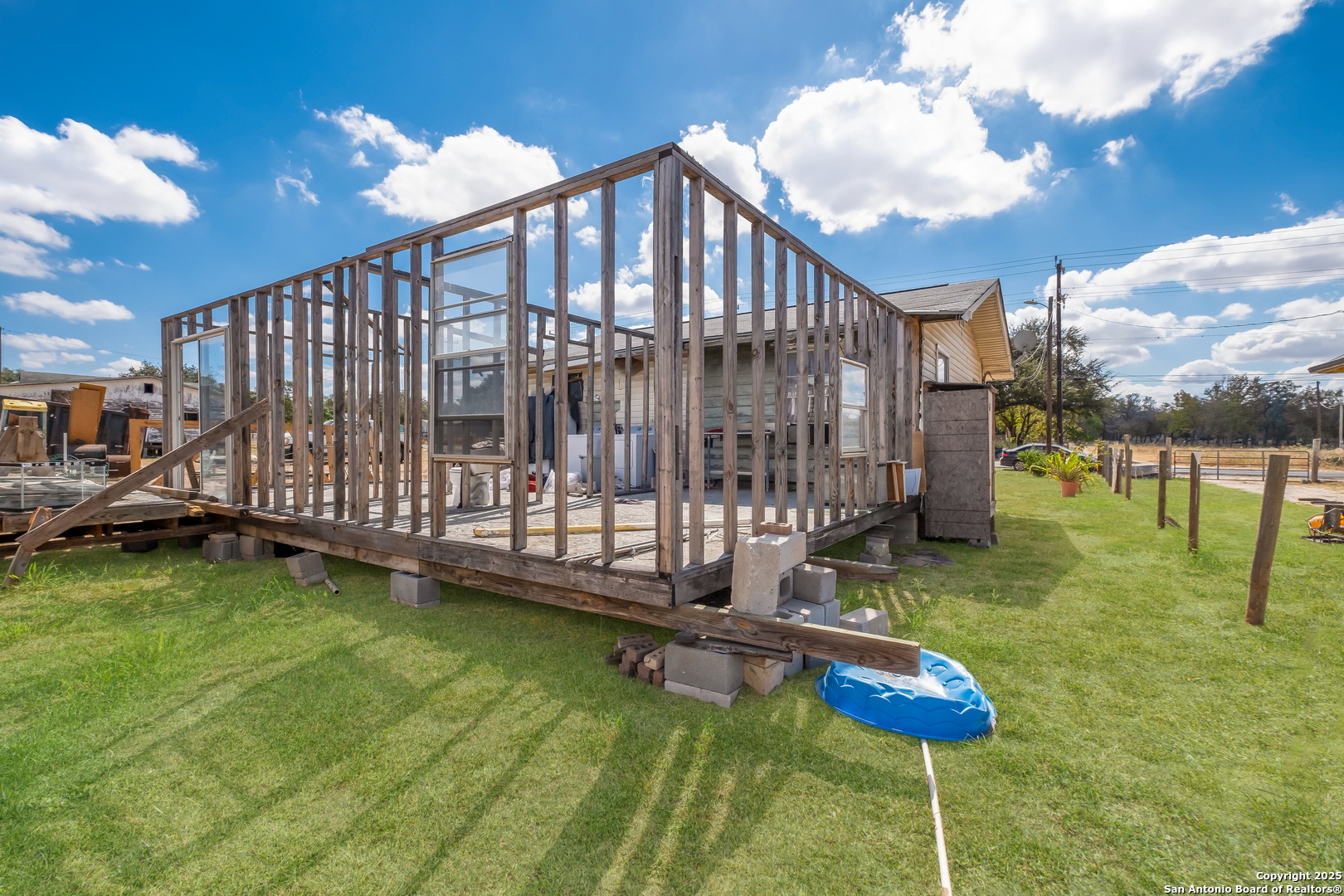 1231 Mogford Road San Antonio, TX 78264 - Photo 4 of 32 a backyard of a house with table and chairs