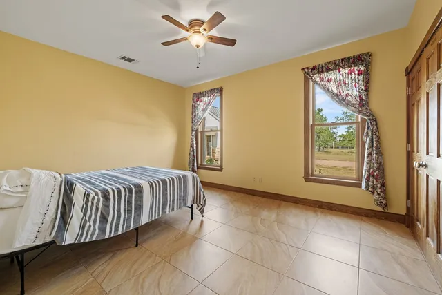 a view of a livingroom with furniture and windows