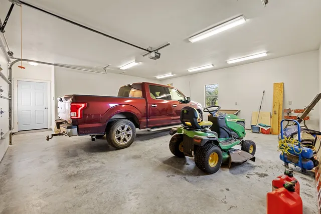 a view of a house with a yard and lake