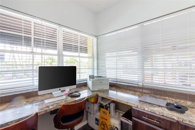 a swimming pool with outdoor seating and yard